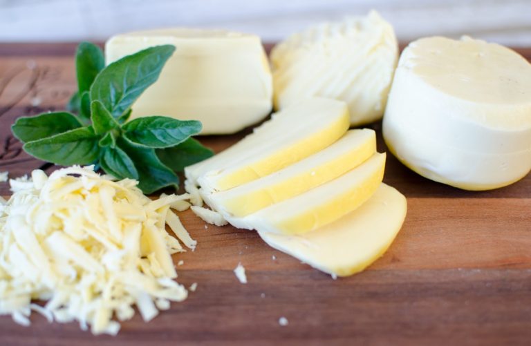 A few pieces of mozzarella cheese cut and grated